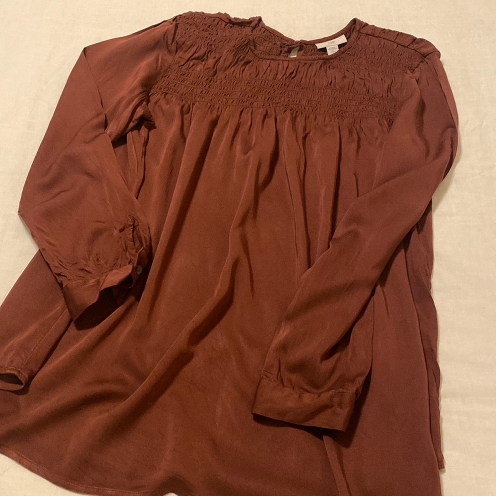 Beautiful burgundy top! Shirred at top.